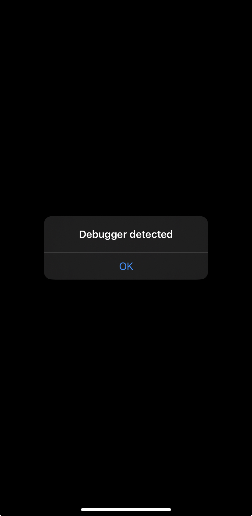 App alert dialog showing Debugger detected message triggering exit